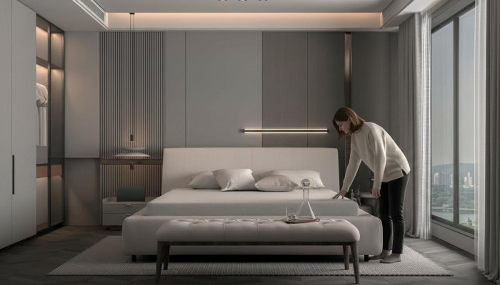 Cama elegante bege com travesseiro